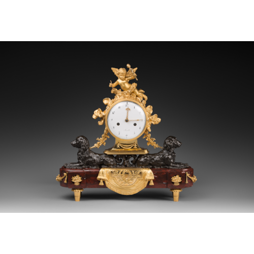 Louis XVI patinated and gilded bronze clock